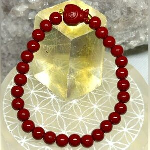 Red Cinnabar Stretch Bracelet with Money Bag Accent